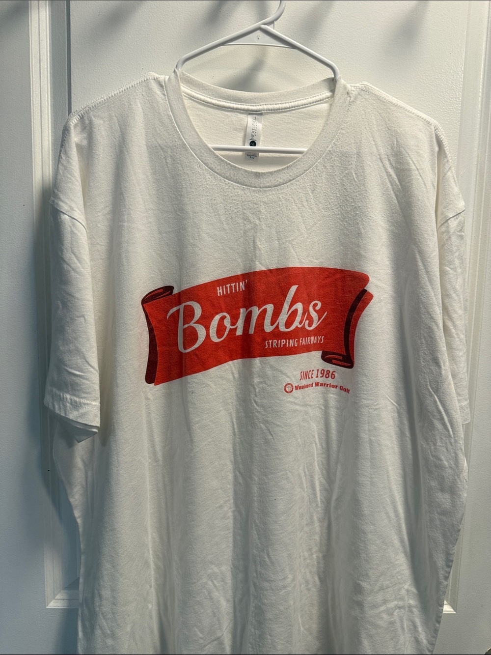 Next Level Apparel White Short Sleeve Tee with Red Graphic "Bombs"